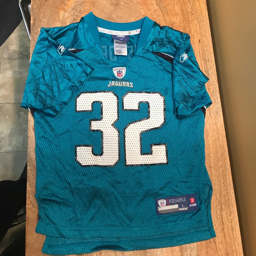 Kids size large authentic Jaguar NFL JERSEY.